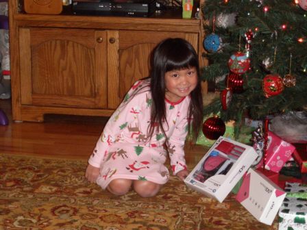 Kasen with her gift from Santa (a DSi)